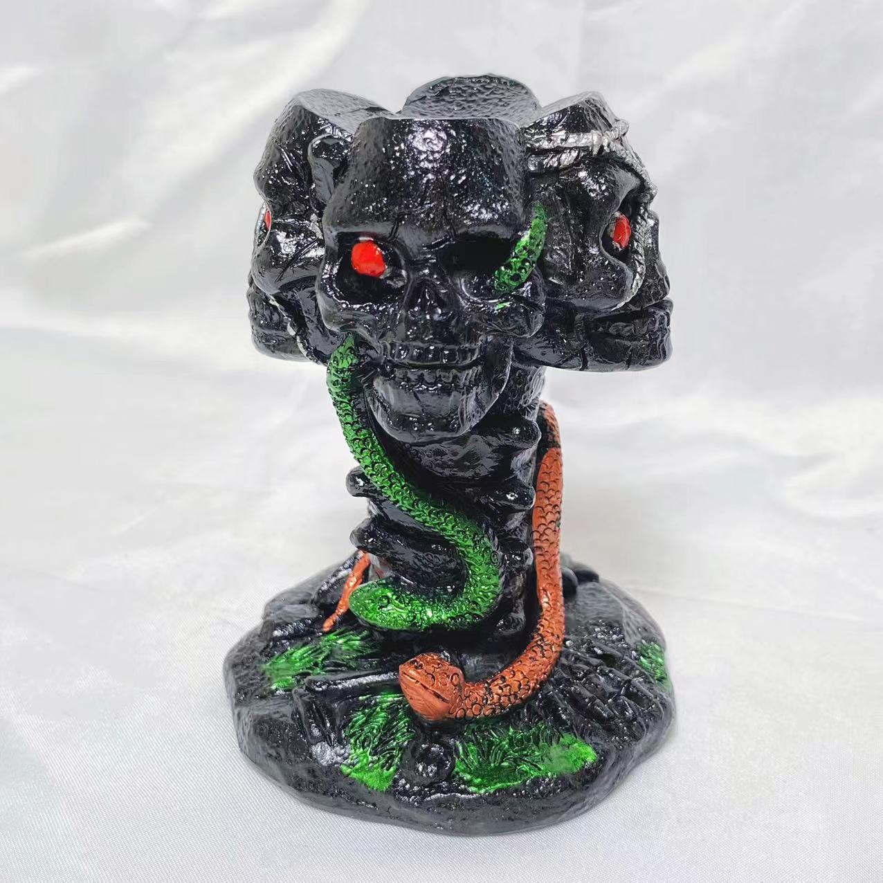Resin four skulls sphere stand