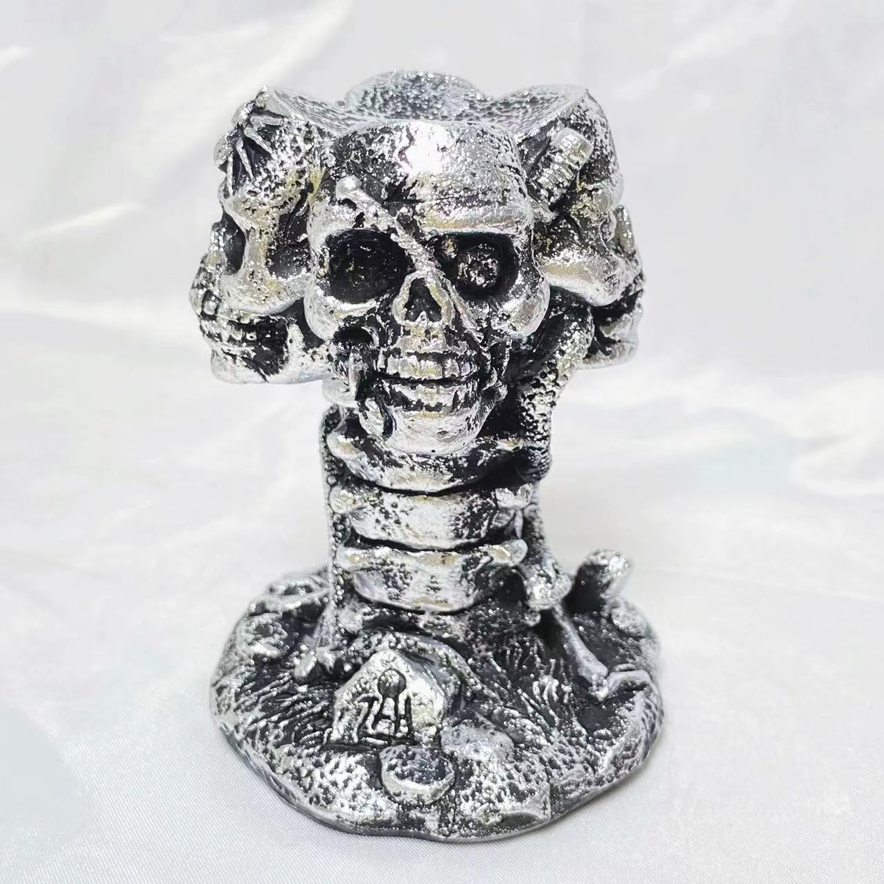 Resin four skulls sphere stand