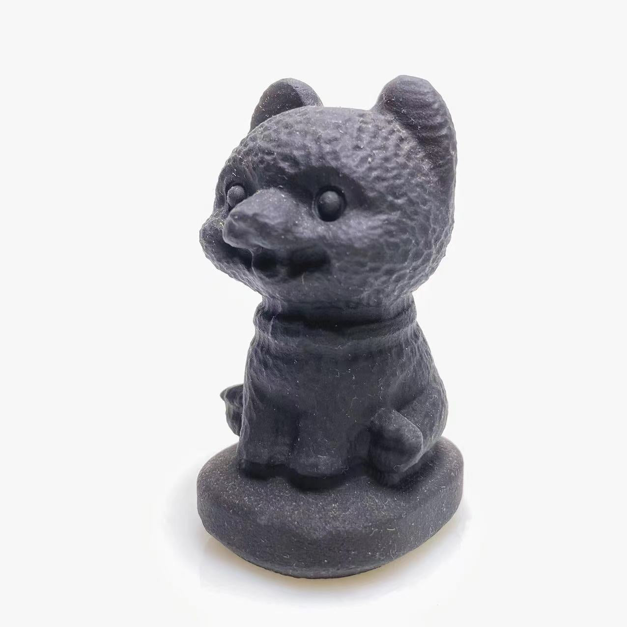 Black obsidian happy dog carving