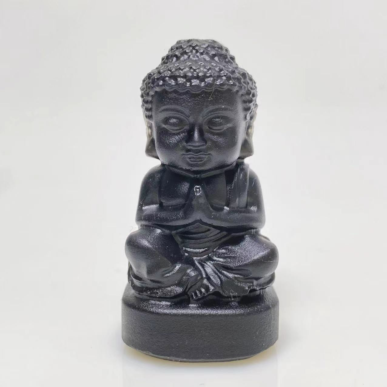 Black obsidian buddha sittig on lotus carving