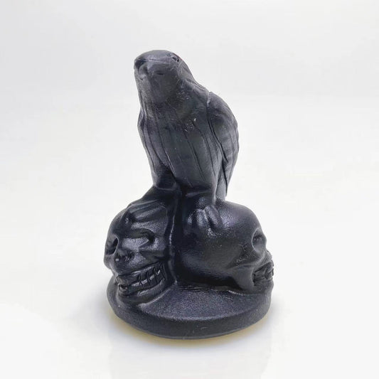 Black obsidian raven on skulls carving