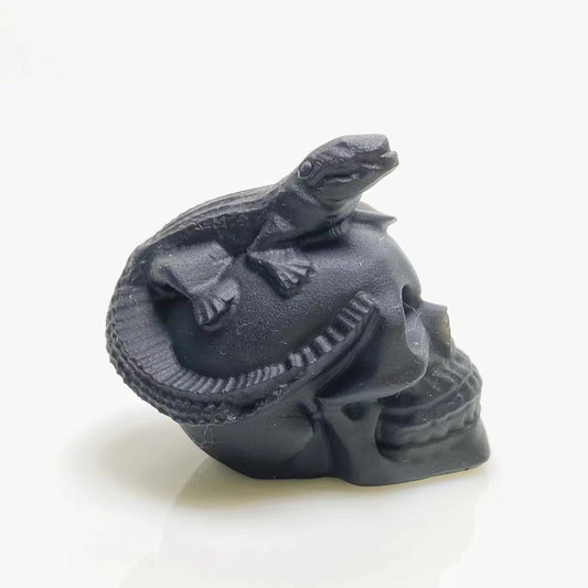 Black obsidian lizard on skull carving
