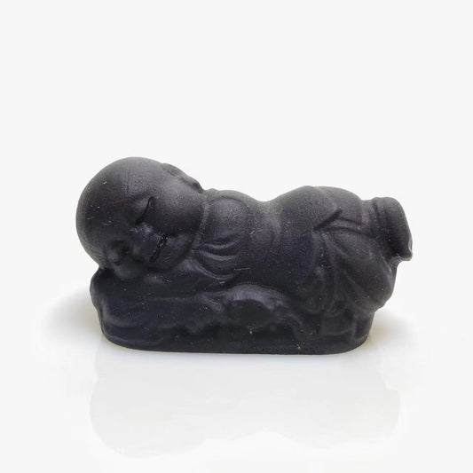 Black obsidian sleeping buddha carving