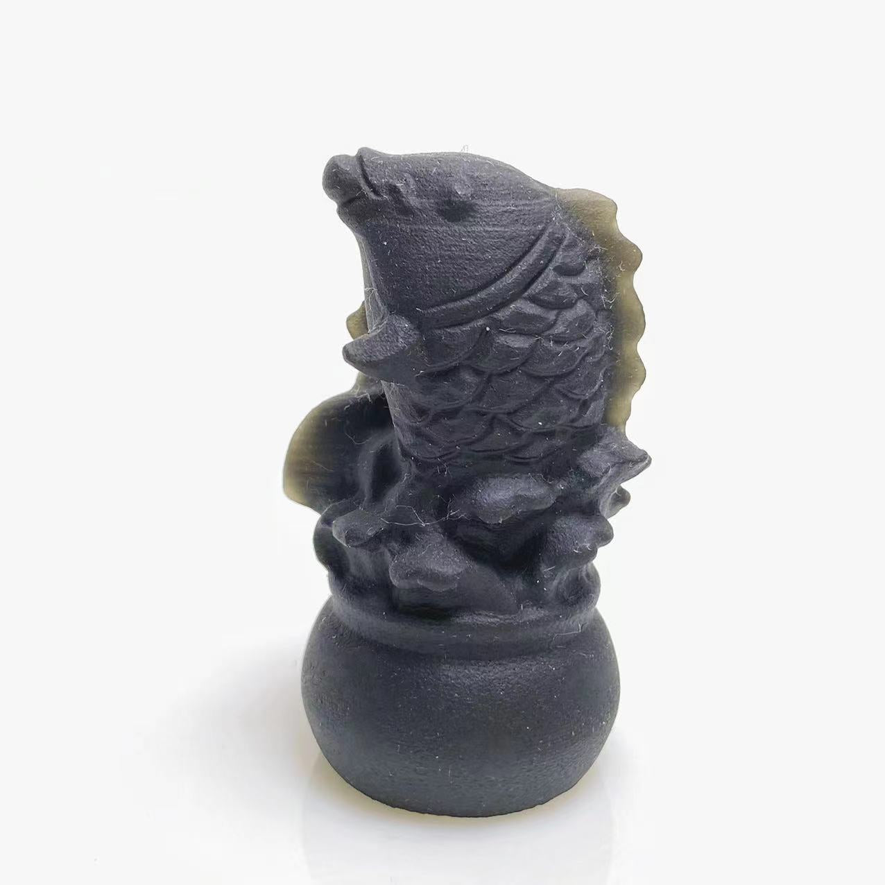 Black obsidian fish carving