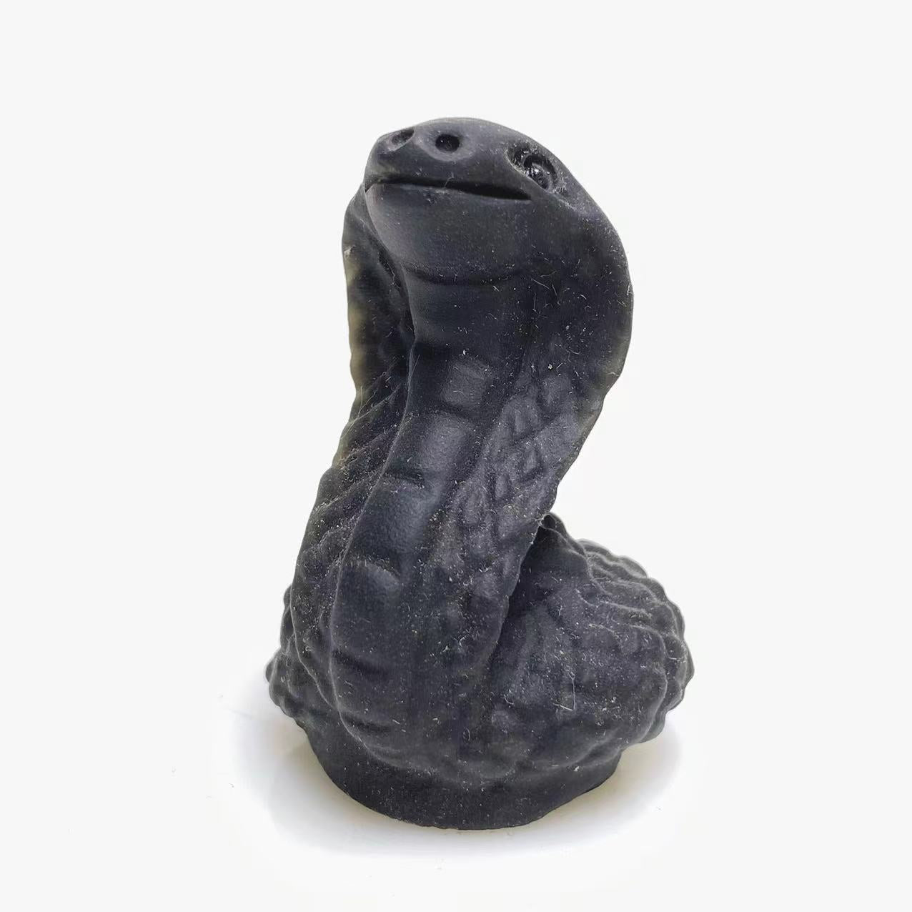 Black obsidian snake carving