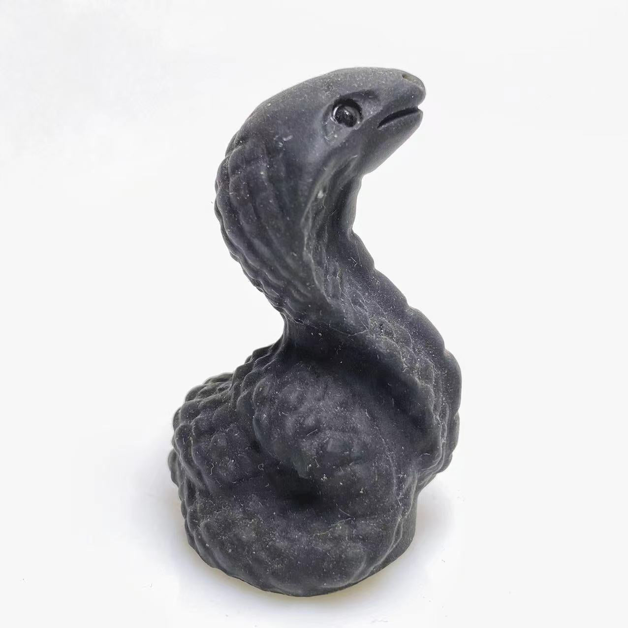 Black obsidian snake carving