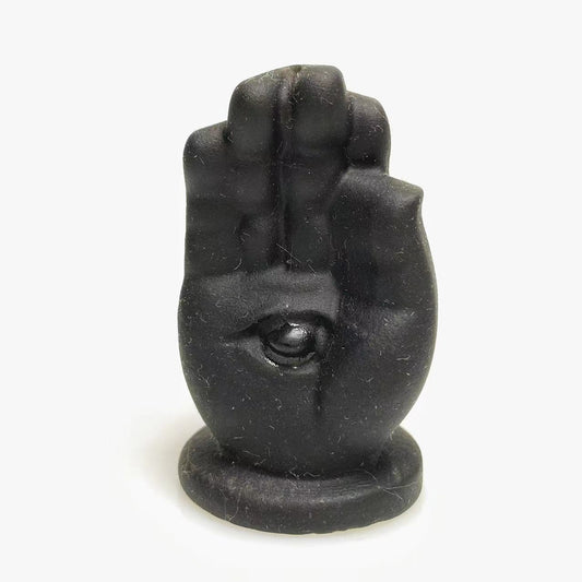 Black obsidian hand with eye carving