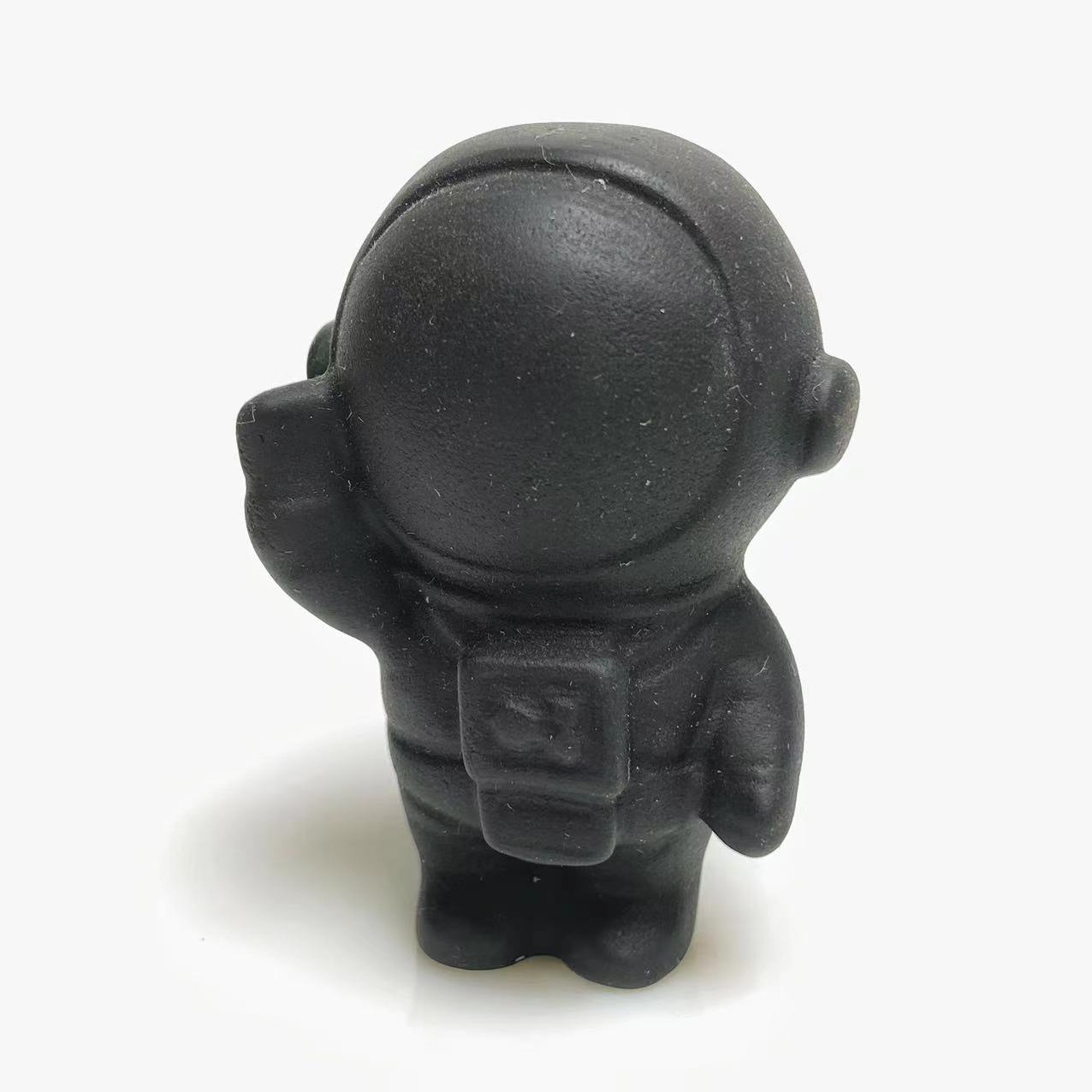 Black obsidian spaceman carving