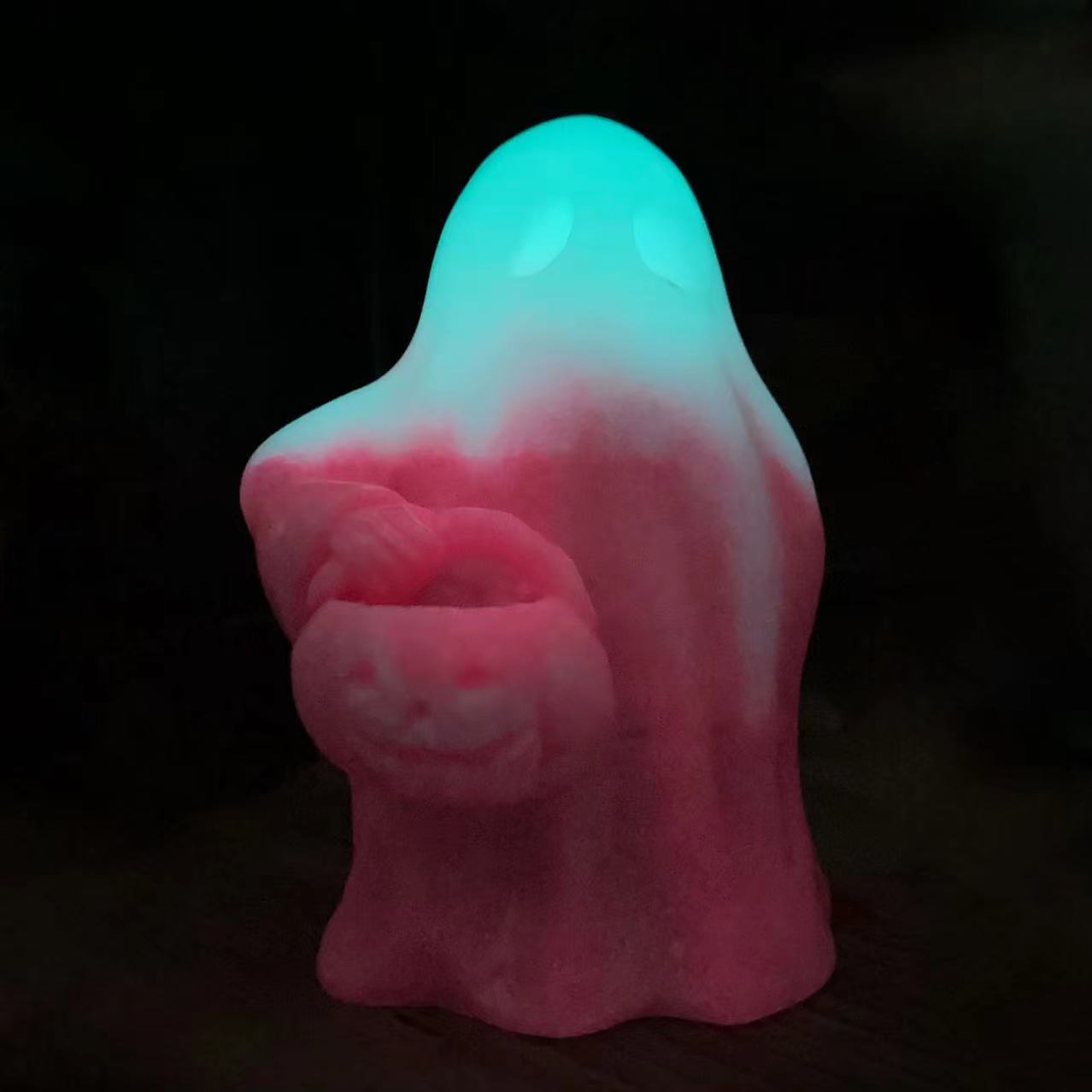 Luminous ghost with pumpkin carving