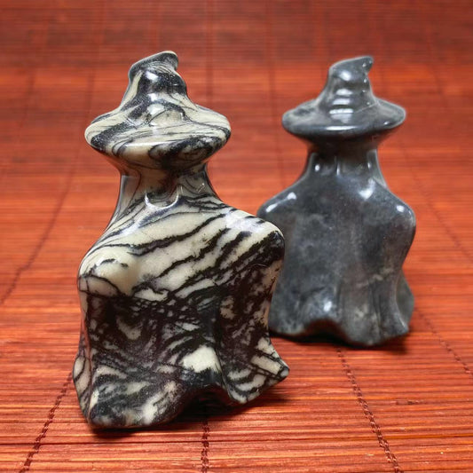 Black vein jasper ghost with witch hat carving