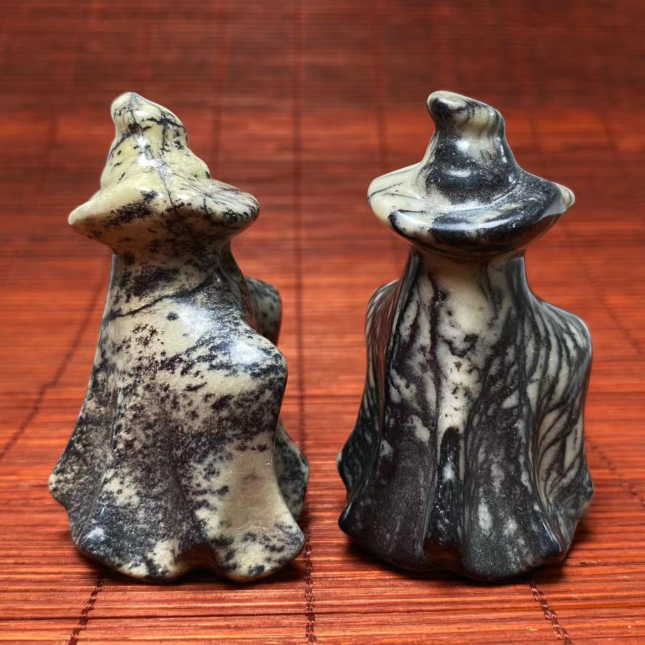 Black vein jasper ghost with witch hat carving