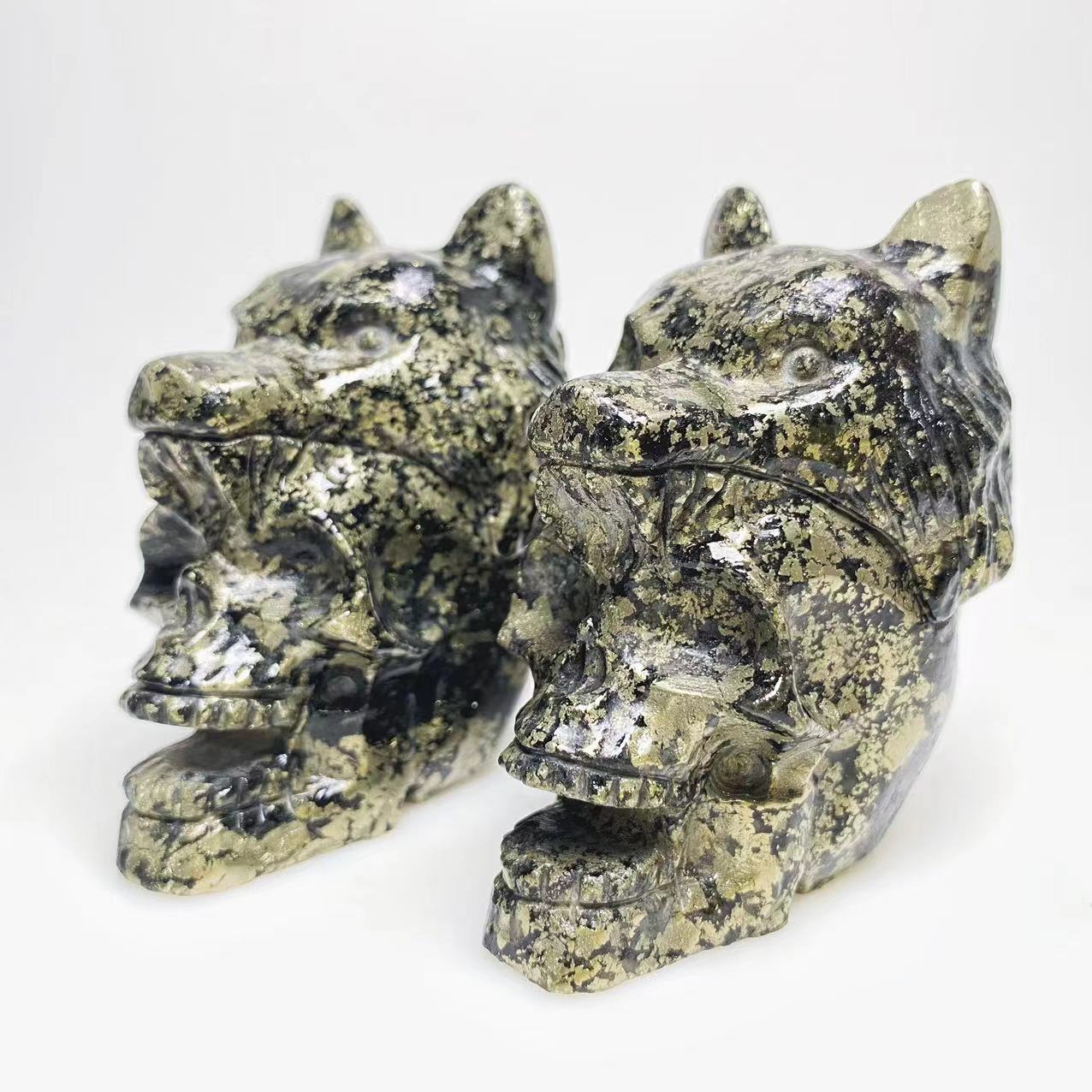 Pyrite skull with wolf head carving