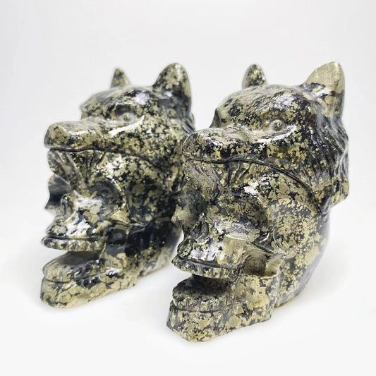 Pyrite skull with wolf head carving