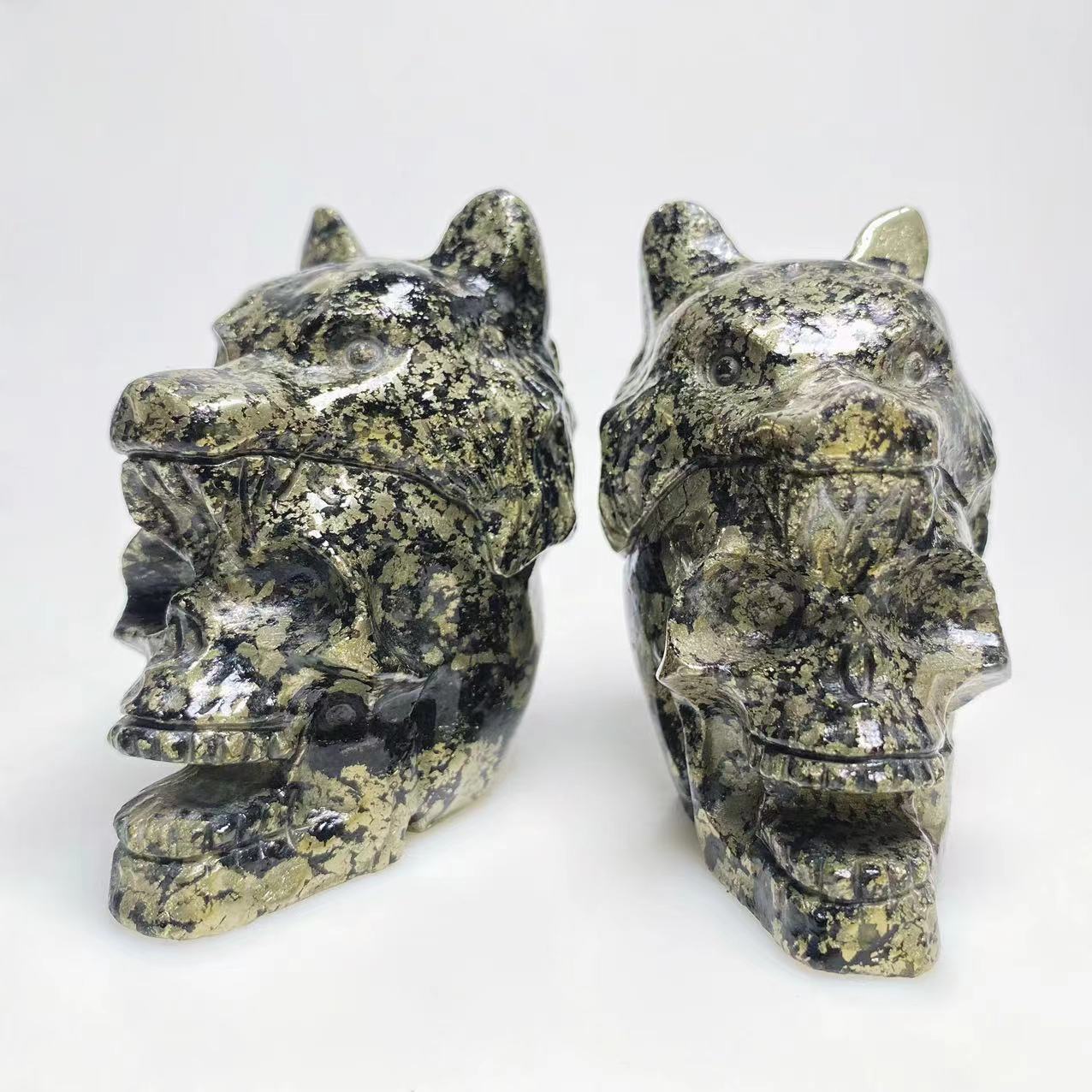 Pyrite skull with wolf head carving