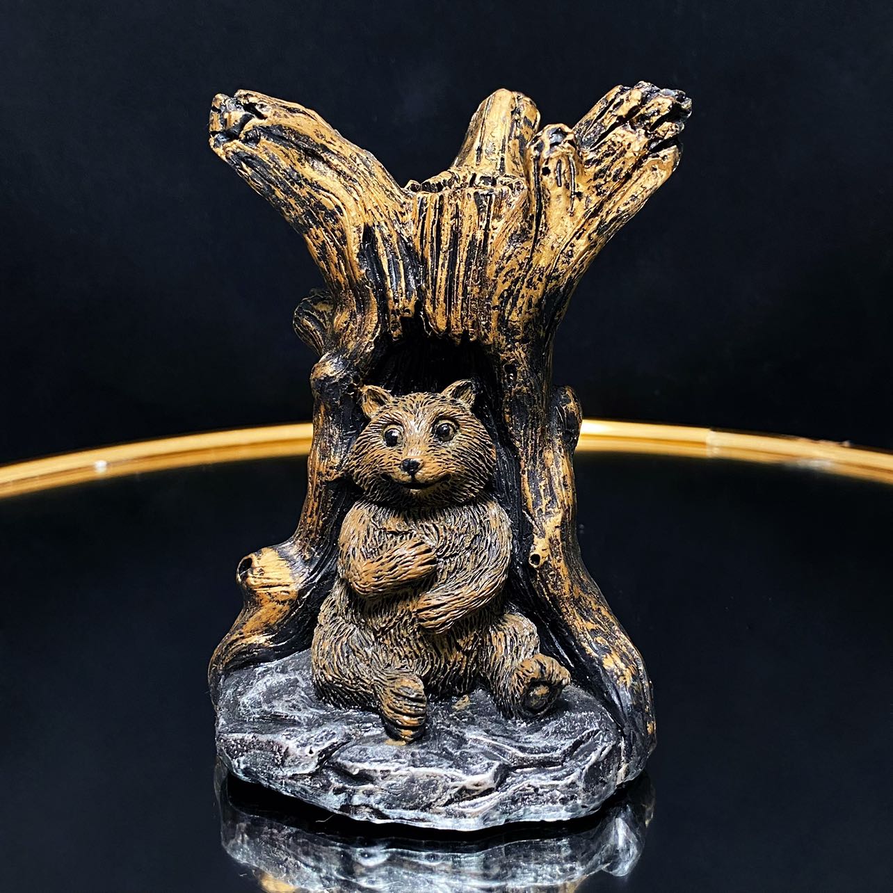 Resin bear with tree sphere stand