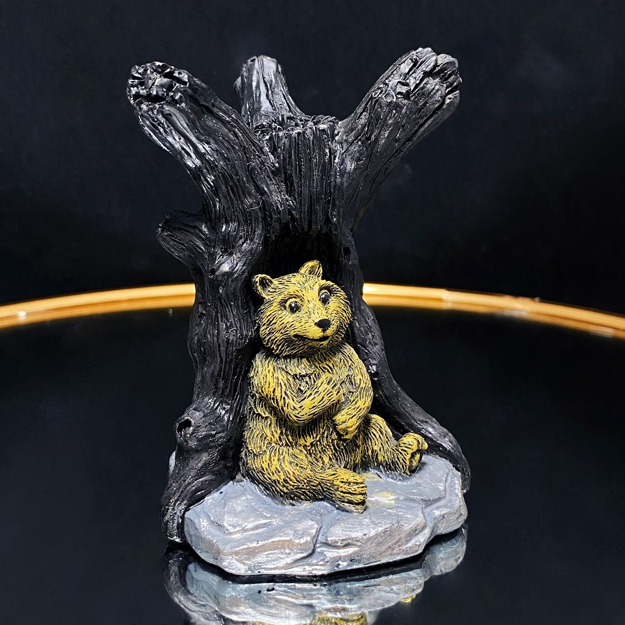Resin bear with tree sphere stand