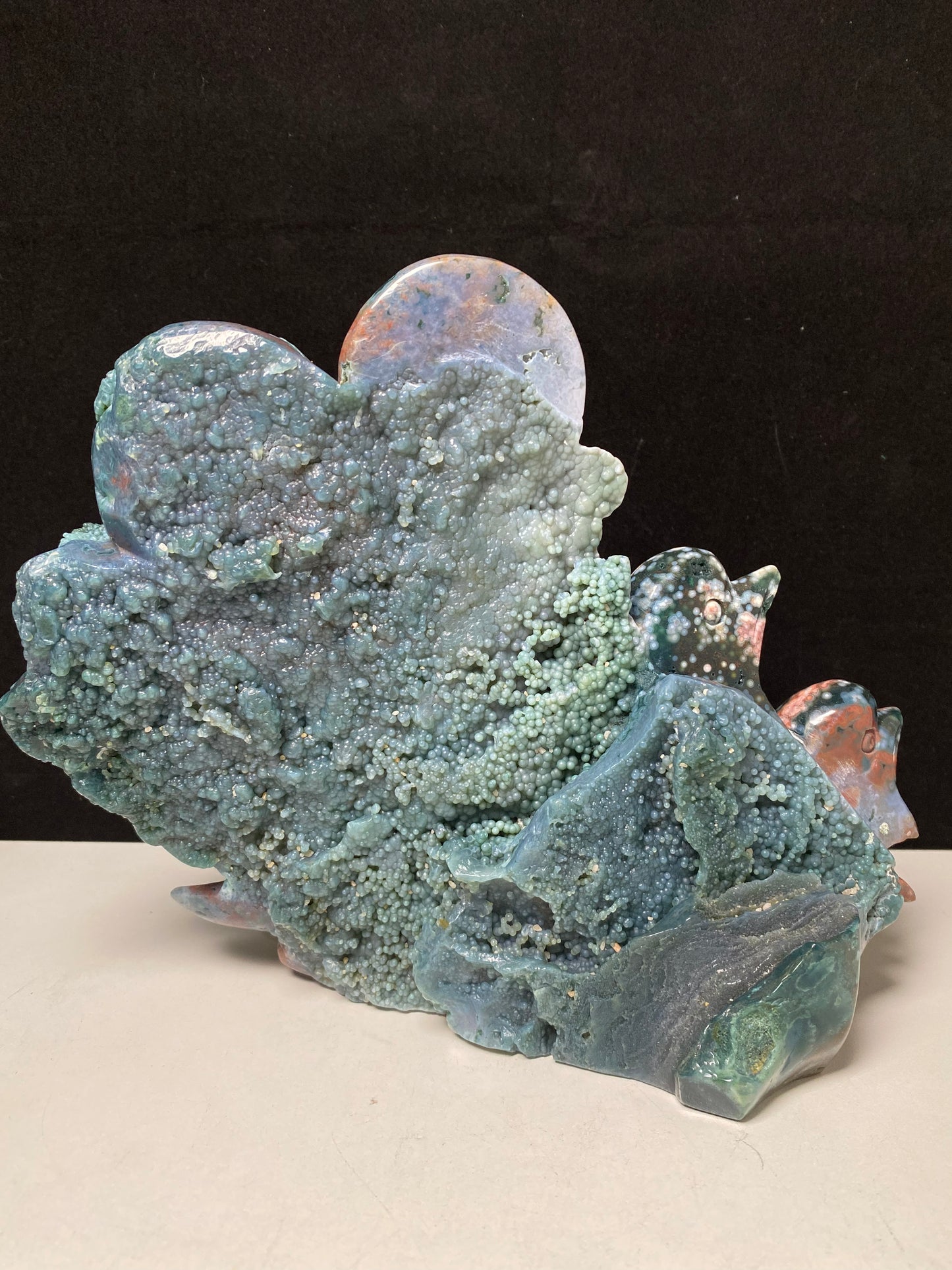 053-Ocean jasper with circles three dolphins carving #2692