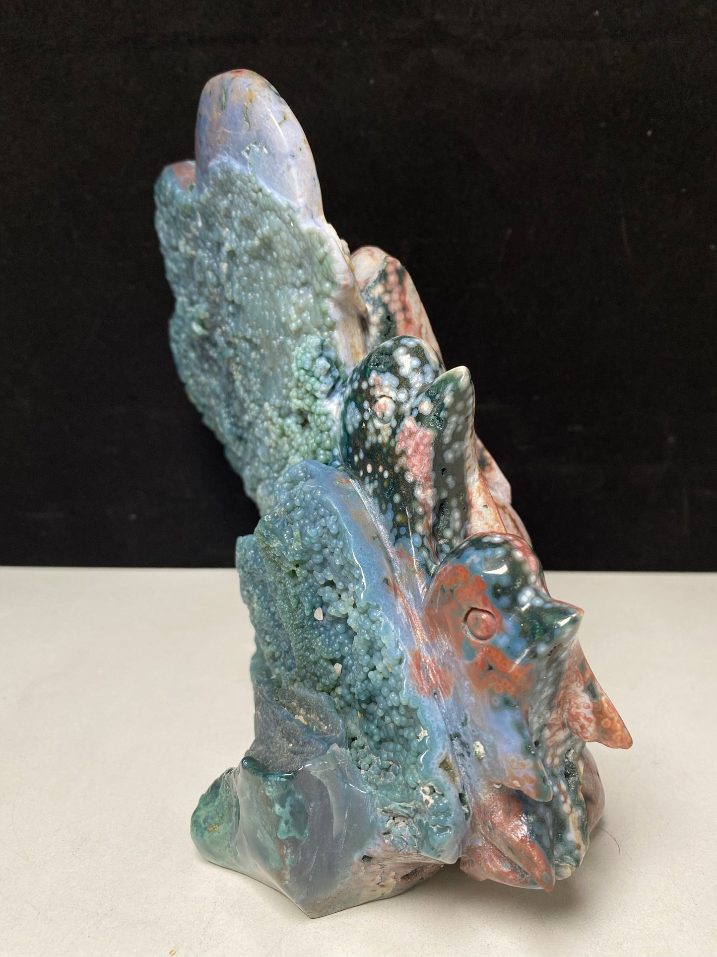 053-Ocean jasper with circles three dolphins carving #2692
