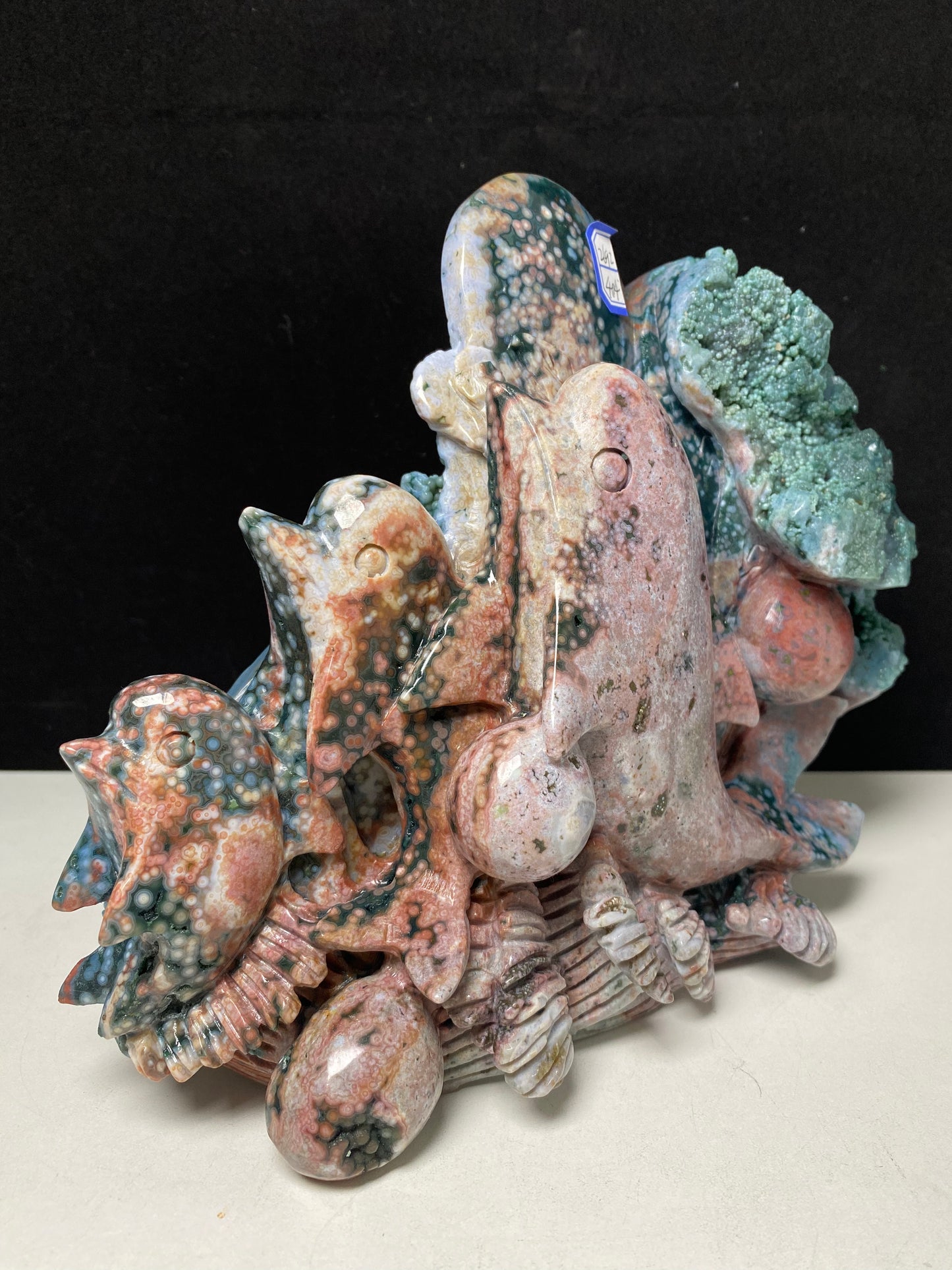 053-Ocean jasper with circles three dolphins carving #2692