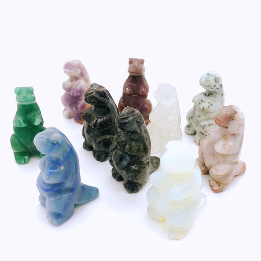 Small crystal dinosaur carvings of different materials